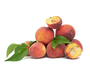 heap of ripe red peach and green leaves, sweet fruit