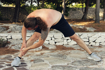 Man stretching outdoors