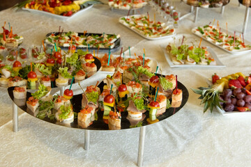 small sandwiches on a tray banquet table food photo