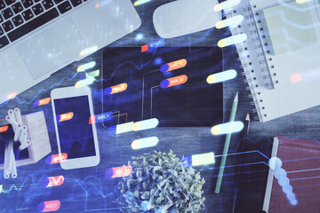 Double exposure of technology theme drawing over work table desktop. Top view. Global data analysis concept.
