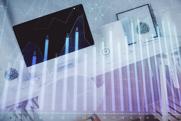 Double exposure of financial graph drawing and office interior background. Concept of stock market.