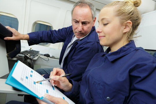 portrait of female aero engineer with clipboard carrying out check