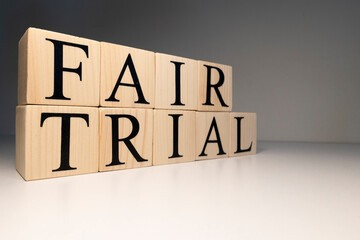 Fair trial word from wooden cubes. About law terms.