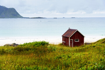 Red Rorbu at Ramberg Beach in Lofoten Islands, Norway