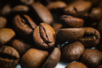 roasted coffee beans closeup on a dark background style food colombian brazil guatemala classic...