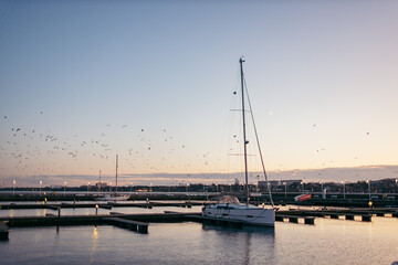 A boat is docked next to a body of water