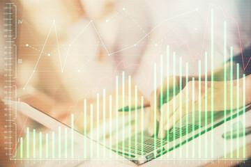 Double exposure of woman hands typing on computer and forex chart hologram drawing. Stock market invest concept.