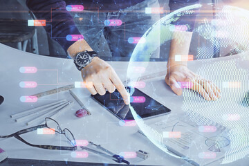 Multi exposure of man's hands holding and using a digital device and map drawing. International business concept.