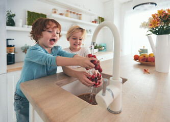 happy kids washing cherries under tap water at the kitchen - 361211701