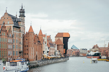 A boat in the water with a city in the background
