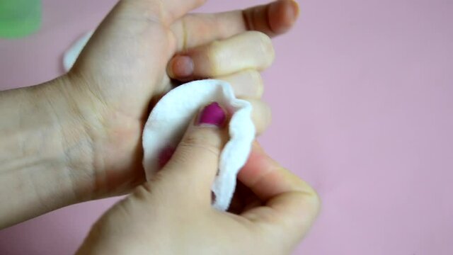 Close up image of woman using nail buffer when doing manicure, polishing nails at home. Smiling lady testing new beauty products and modern cosmetics, doing morning makeup or daily nail care routine