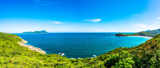 China Guangdong Shenzhen Dapeng Peninsula Dongchong coastline summer blue sky and white clouds scenery
