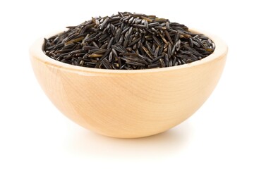 Heap of uncooked, raw, black wild rice grains in wooden bowl over white