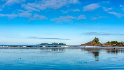 A beautiful blue sky reflecting in the water in Tofino Canada