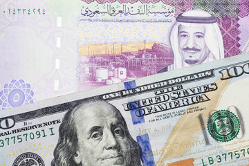 A close up image of a one American one hundred dollar note close up in macro with a colorful five...