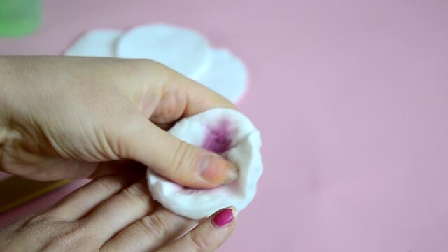 Close up image of woman using nail buffer when doing manicure, polishing nails at home. Smiling lady testing new beauty products and modern cosmetics, doing morning makeup or daily nail care routine