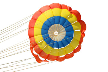 Obraz premium multi-colored blue red yellow color of an isolated parachute with slings with strong ropes, the parachute is open due to the flow of strong air, on a white background for copying, active sport