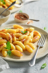 Delicious potato dumplings with cinnamon, sugar and mint leaves