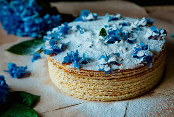 step by step, making a waffle cake, with condensed milk, and decorating with blue flowers