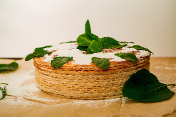 cooking waffle cake, step by step, with boiled condensed milk, and garnished with fresh mint leaves