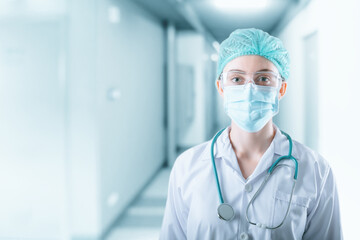 Fototapeta na wymiar Medical Surgical Doctor and Health Care, Portrait of Surgeon Doctor in PPE Equipment on Isolated Background. Medicine Female Doctors Wearing Face Mask and Cap for Patients Surgery Work. Medic Hospital