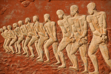 Chained slaves relief on Door of No Return memorial, Ouidah, Benin