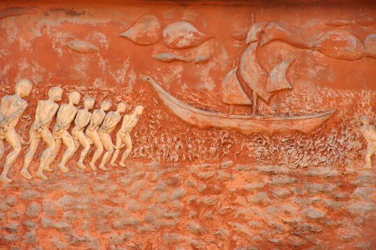 Chained slaves going to ship, relief on Door of No Return memorial, Ouidah, Benin