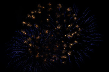 Blue and white abstract shimmering firework bursts created using intentional camera movement