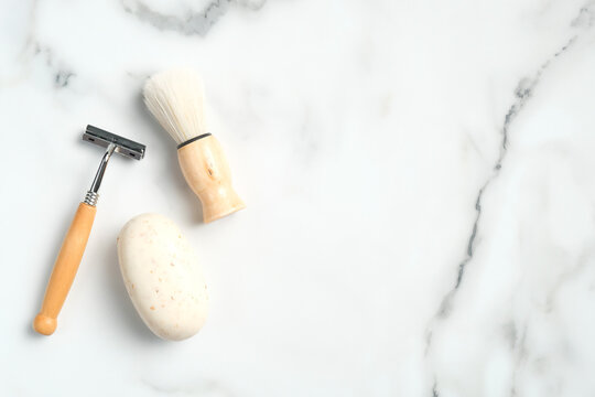 Zero Waste Set Of Man Bath Cosmetics And Accessories. Flat Lay Shaving Brush, Razor And Homemade Organic Soap On Marble Background. Top View With Copy Space.