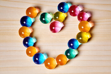 Jelly balls in a heart shape. Sweet dessert and love present. Food and drink backgrounds