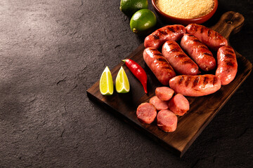 Fresh grilled Pepperoni sausage. Grilled Pepperoni Sausage on wooden board.  - obrazy, fototapety, plakaty