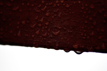 Water on Dark Red Surface