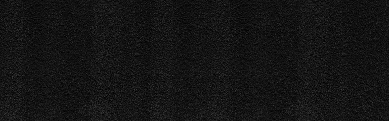 Panorama of black concrete stone texture for background in black.  Cement and sand grey dark detail covering.