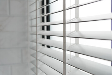 Close-up open venetian blinds. lighting range control sunlight coming from a window. decoration interior. Modern jalousie.