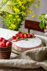 Beautiful delicious strawberry raw cake decorated with berries. Concept of delicious and healthy summer desserts
