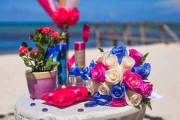 Bridal flowers bouquet on the sandy beach as decoration for tropical destination wedding ceremony 