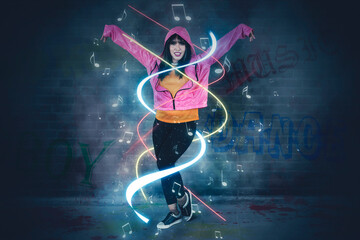 Fototapeta na wymiar Hip-hop dancer with graffiti wall background