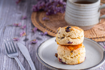 Traditional British scones with a tea cup and blurred background
