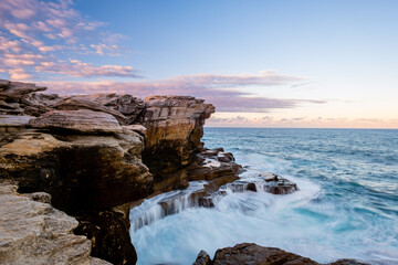 Fototapeta na wymiar Waves Crashing Rocks in Kamay Botany Bay National Park of Australia