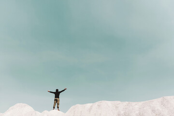 Man rise hands up to sky freedom concept with copyspace blue sky.