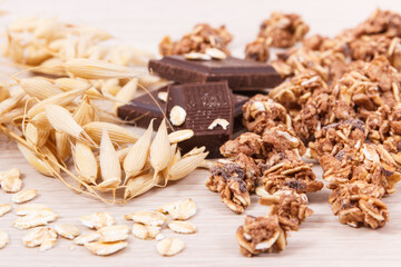 Granola, oat flakes and chocolate as source iron and fiber, healthy snack concept