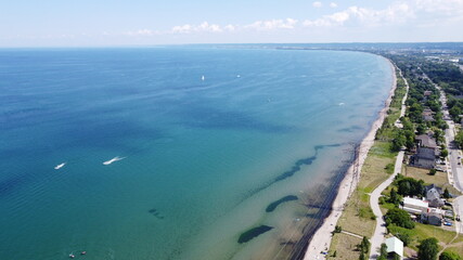 Fototapeta na wymiar Beautiful Aerial Panoramic Landscape image of coastline with lakefront view and clear water