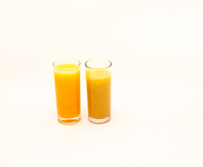 Delicious freshly squeezed fruit juice isolated against a white background 