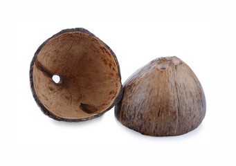 Empty coconut shells on a white wooden table, top view