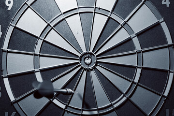 Arrow missing the target in the darts