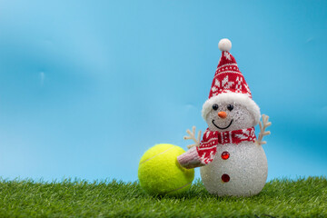 Tennis Christmas Holiday with Snowman and Tennis ball on green grass