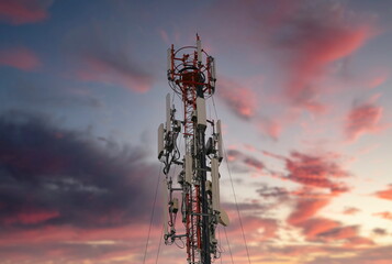 Telecommunication tower 4G and 5G. Macro Base Station or Base Transceiver Station. Wireless Communication Antenna Transmitter. Development of communication systems in urban area at sunset.