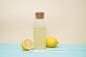 Lemonade or mojito cocktail with lemon and mint, cold refreshing drink or beverage with ice. Copy space for your text