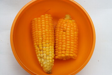 corn or maize in orange bowl