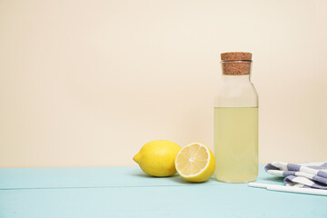 Lemonade or mojito cocktail with lemon and mint, cold refreshing drink or beverage with ice. Copy space for your text